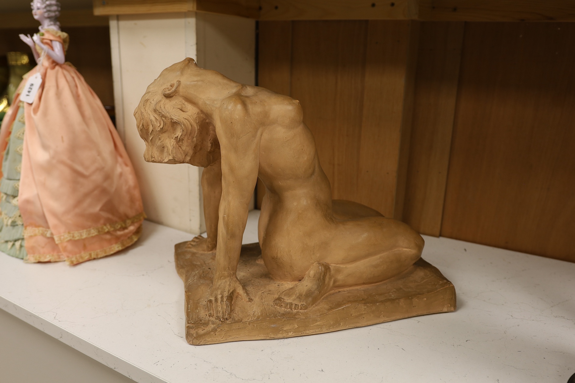 A French Art Deco terracotta semi reclining nude, stamped M. Lequesne, 36cm high. Condition - fair to good, slight scratches